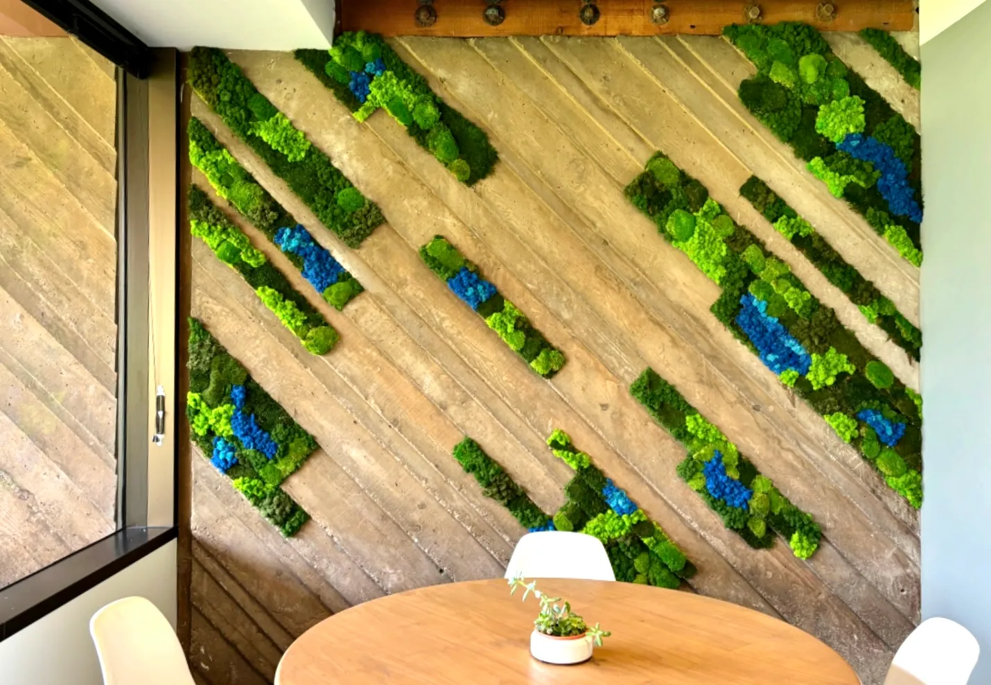 Diagonal moss strips on a wood wall