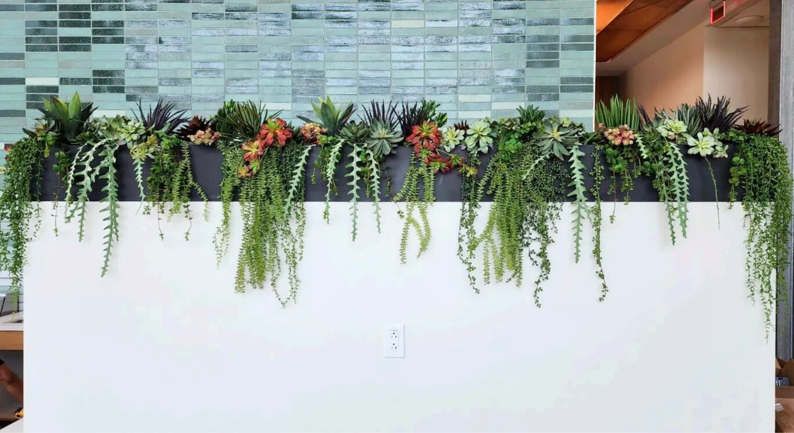Cascading faux greenery along a ledge