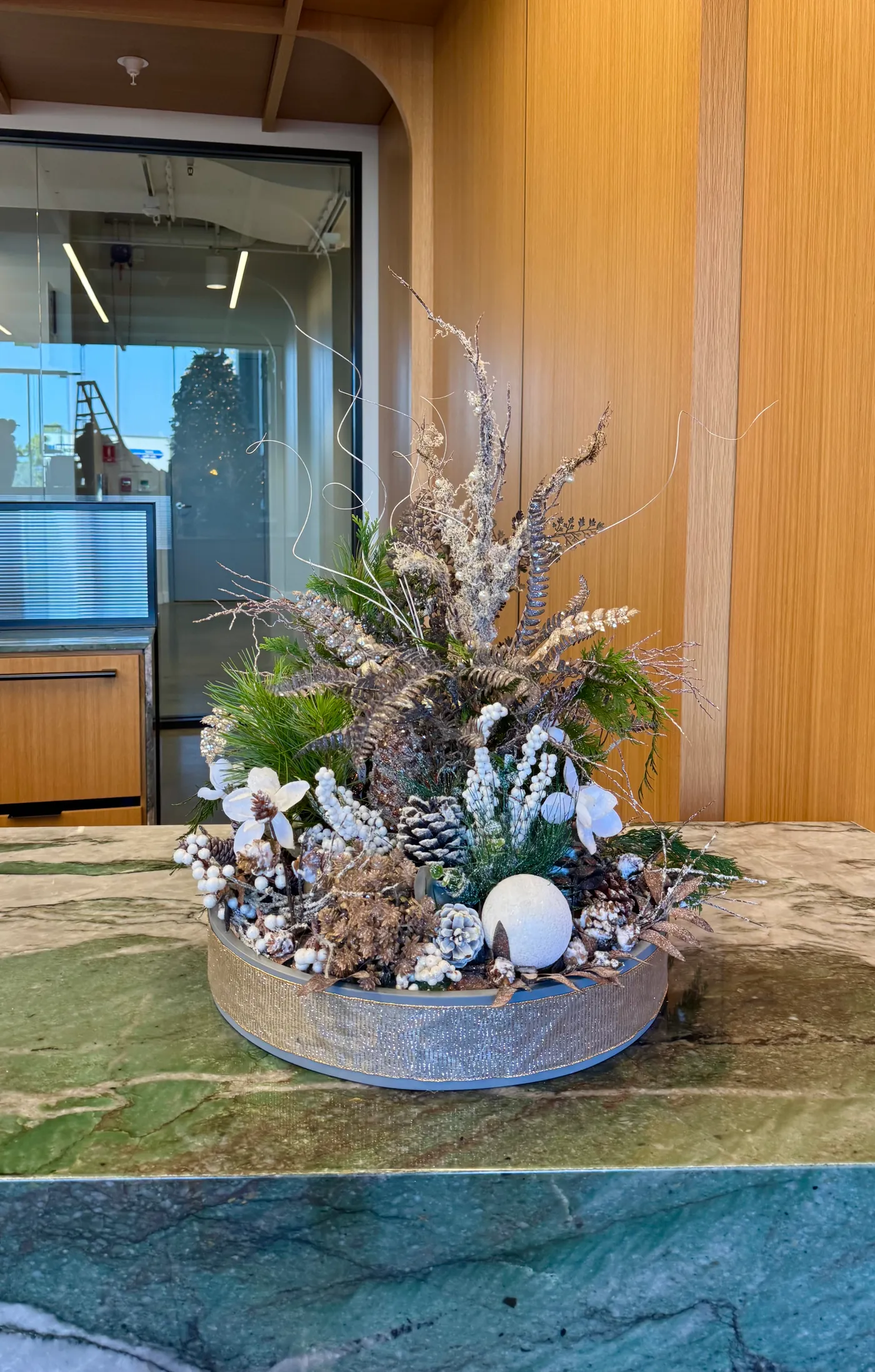 A holiday arrangement on a reception desk