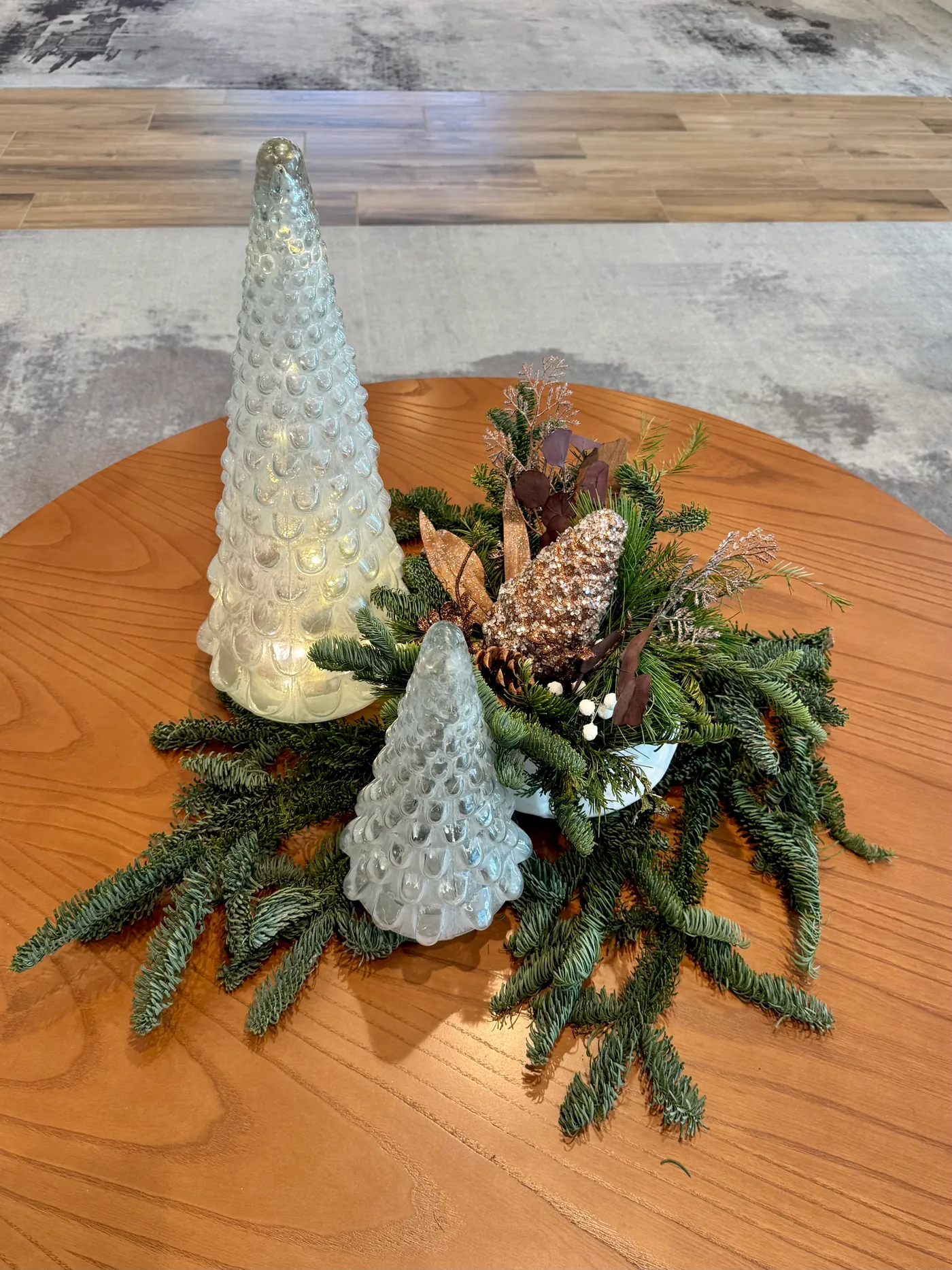 A holiday centerpiece with cone trees