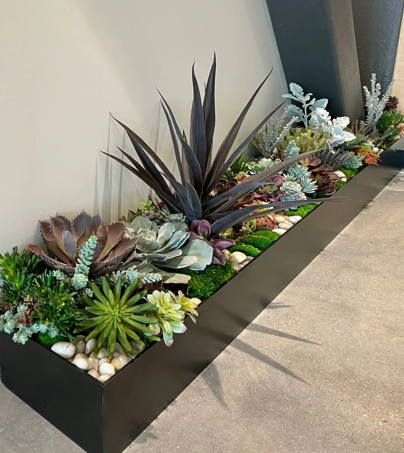 A long faux succulent planter